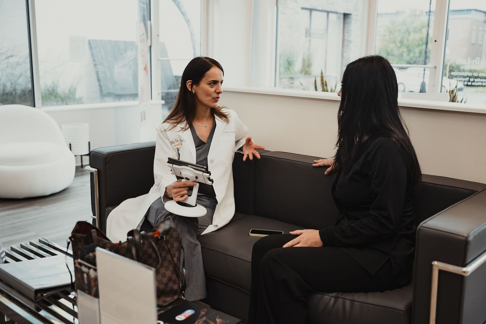 Provider reviewing pre and post care instructions with a patient at Skin Lab Med Spa in Falls Church, VA